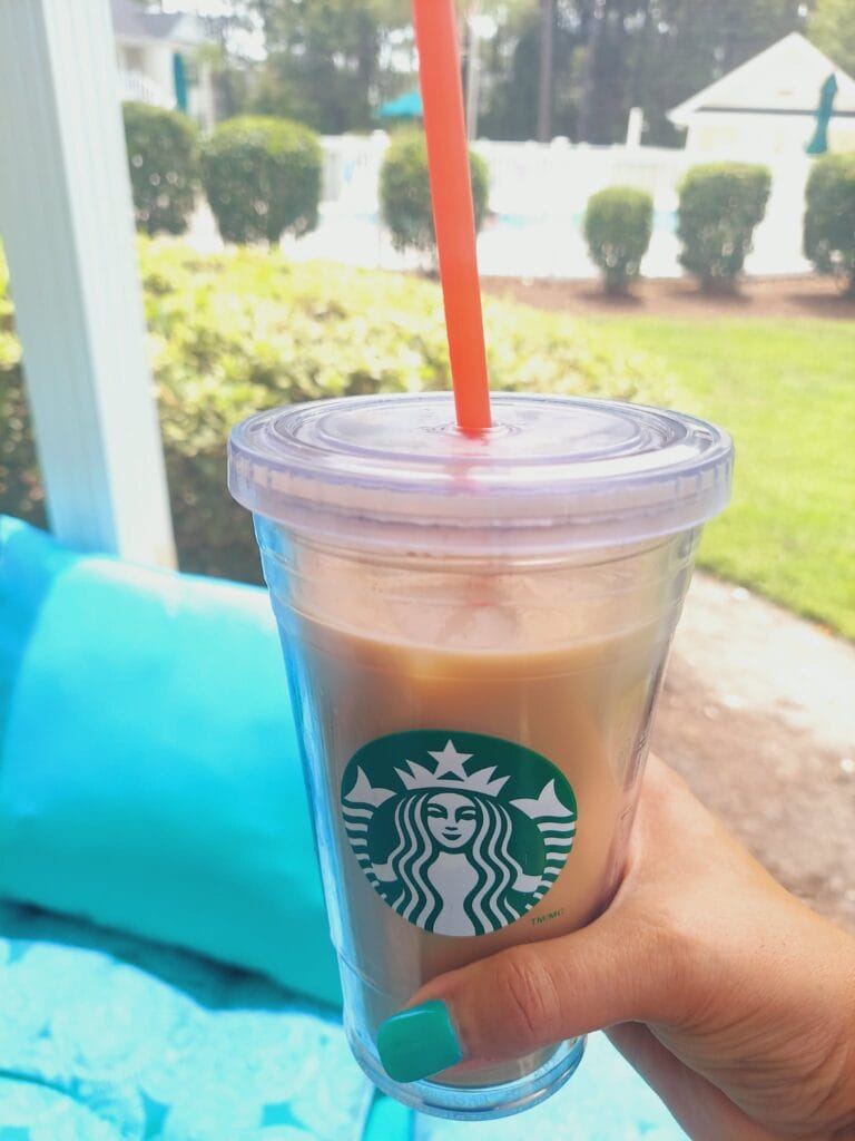 iced coffee in a clear reusable starbucks cup